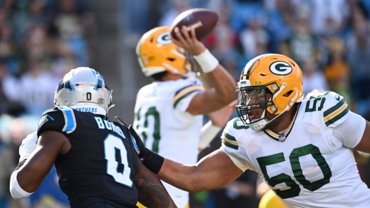 Green Bay Packers right tackle Zach Tom blocks Brian Burns.