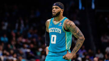 Apr 7, 2024; Charlotte, North Carolina, USA; Charlotte Hornets forward Miles Bridges (0) looks on during the third quarter against the Oklahoma City Thunder at Spectrum Center.