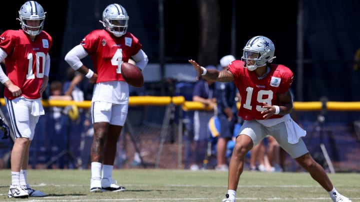 Jul 31, 2024; Oxnard, CA, USA; Dallas Cowboys quarterback Trey Lance (19) pitches in front of quarterback Cooper Rush (10) and quarterback Dak Prescott (4) during training camp at the River Ridge Playing Fields in Oxnard, California.  