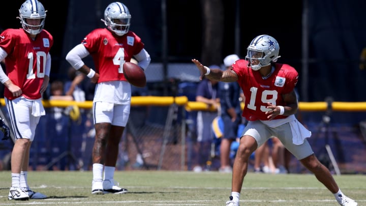 Jul 31, 2024; Oxnard, CA, USA; Dallas Cowboys quarterback Trey Lance (19) pitches in front of quarterback Cooper Rush (10) and quarterback Dak Prescott (4) during training camp at the River Ridge Playing Fields in Oxnard, California.  