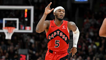 Jan 1, 2025; Toronto, Ontario, CAN;  Toronto Raptors guard Immanuel Quickley (5) reacts after making a three-point basket against the Brooklyn Nets in the first half at Scotiabank Arena. Mandatory Credit: Dan Hamilton-Imagn Images