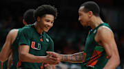 Feb 11, 2025; Coral Gables, Florida, USA; Miami Hurricanes guard Jalil Bethea (3) celebrates with guard Matthew Cleveland (0) after scoring against the Syracuse Orange during the second half at Watsco Center. Mandatory Credit: Sam Navarro-Imagn Images