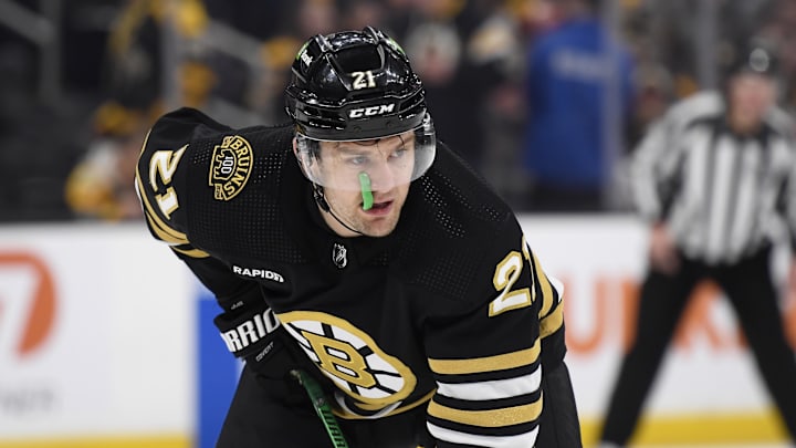 Dec 3, 2023; Boston, Massachusetts, USA; Boston Bruins left wing James van Riemsdyk (21) gets set for a face-off during the third period against the Columbus Blue Jackets at TD Garden. Mandatory Credit: Bob DeChiara-Imagn Images