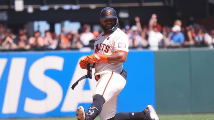 Jun 30, 2024; San Francisco, California, USA; San Francisco Giants center fielder Heliot Ramos (17) smiles after hitting a double against the Los Angeles Dodgers during the eighth inning at Oracle Park.