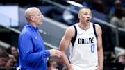 Feb 13, 2025; Dallas, Texas, USA;  Dallas Mavericks head coach Jason Kidd speaks with Dallas Mavericks guard Dante Exum (0) during the second half against the Miami Heat at American Airlines Center. Mandatory Credit: Kevin Jairaj-Imagn Images