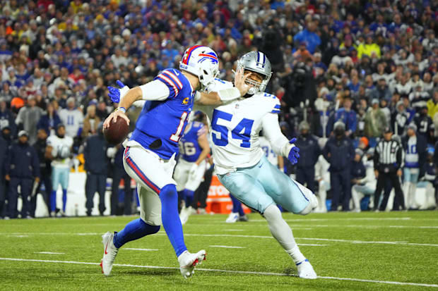Buffalo Bills quarterback Josh Allen attempts to block Dallas Cowboys defensive end Sam Williams. Buffalo Bills quarterback Josh Allen attempts to block Dallas Cowboys defensive end Sam Williams.