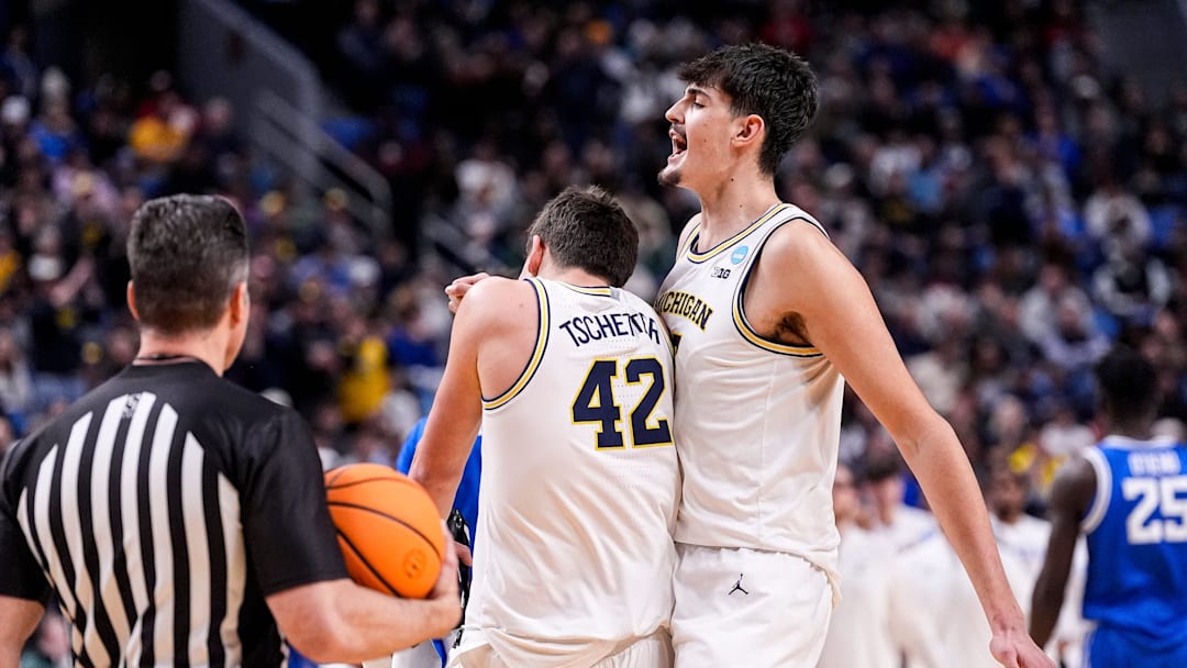 Michigan center Aday Mara (15) and forward Will Tschetter (42) celebrate a play against Saint Louis during the second half of NCAA Tournament Second Round at KeyBank Center in Buffalo on Saturday, March 21, 2026.