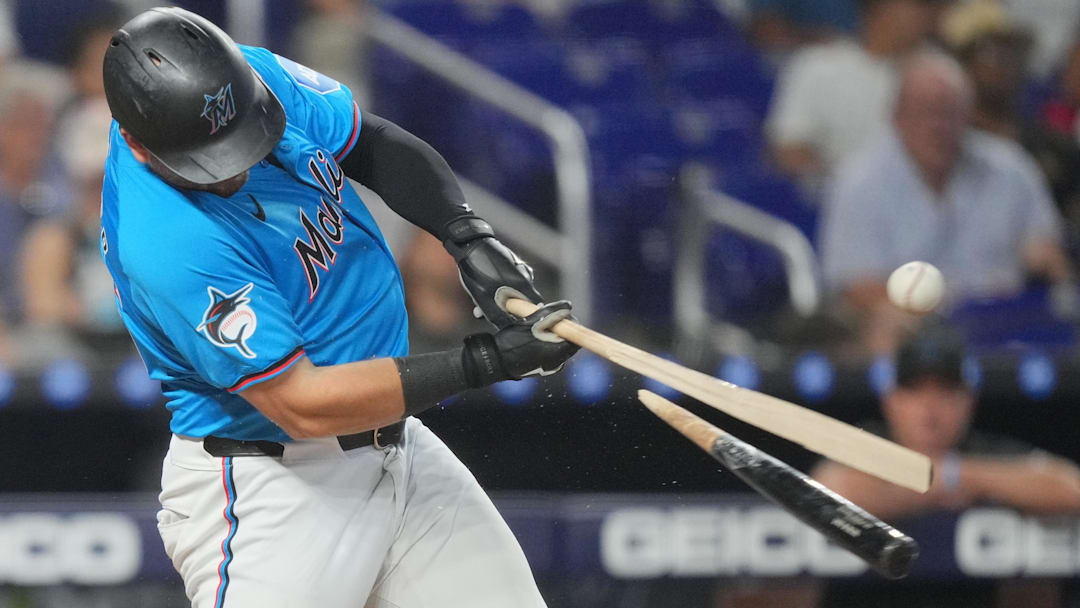 Sep 22, 2024; Miami, Florida, USA;  Miami Marlins designated hitter Jake Burger (36) breaks his bat while hitting single in the eighth inning against the Atlanta Braves at loanDepot Park. Jim Rassol-Imagn Images