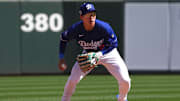  Los Angeles Dodgers second base Hyeseong Kim (6) fields a ground ball against the San Francisco Giants during the third inning at Camelback Ranch in Glendale, Ariz., on March 1, 2025.