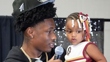 Friends and family celebrate after Booker High defensive end/wide receiver Chauncey Kennon announces he has selected Florida State University to commit to during a party Sunday afternoon, July 6, 2025 at the DeSoto Boys and Girls Club in Bradenton.