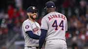 Sep 12, 2025; Atlanta, Georgia, USA; Houston Astros third baseman Carlos Correa (1) and designated hitter Yordan Alvarez (44) celebrate after a victory over the Atlanta Braves at Truist Park. 
