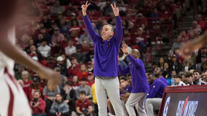 Feb 12, 2025; Fayetteville, Arkansas, USA;  LSU Tigers head coach Matt McMahon signals to his players on the court during the first half against the Arkansas Razorbacks at Bud Walton Arena. Arkansas won 70-58.  Mandatory Credit: Brett Rojo-Imagn Images