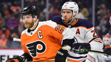 Mar 1, 2022; Philadelphia, Pennsylvania, USA; Philadelphia Flyers center Claude Giroux (28) and Edmonton Oilers center Leon Draisaitl (29) at Wells Fargo Center. Mandatory Credit: Eric Hartline-USA TODAY Sports