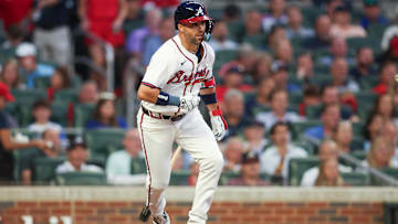 Sep 3, 2024; Atlanta, Georgia, USA; Atlanta Braves second baseman Whit Merrifield (15) hits a single against the Colorado Rockies in the third inning at Truist Park. Mandatory Credit: Brett Davis-Imagn Images 
