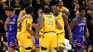 Several Missouri Tigers players huddle late in an upset win versus No. 1 ranked Kansas.
