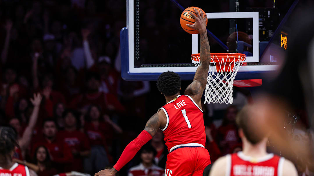 Feb 22, 2025; Tucson, Arizona, USA; Arizona Wildcats guard Caleb Love (1) dunks the ball with one hand during the first half against the BYU Cougars at McKale Center. Mandatory Credit: Aryanna Frank-Imagn Images