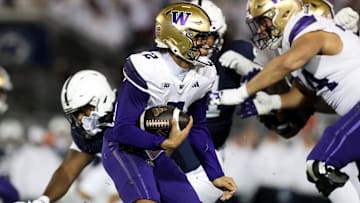 Nov 9, 2024; University Park, Pennsylvania, USA; Washington Huskies quarterback Demond Williams Jr (2) runs with the ball against the Penn State Nittany Lions during the third quarter at Beaver Stadium. Penn State won 35-6. Mandatory Credit: Matthew O'Haren-Imagn Images