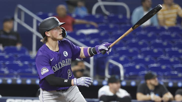 Jun 2, 2025; Miami, Florida, USA;  Colorado Rockies catcher Hunter Goodman (15) watches his home run against the Miami Marlins during the fifth inning at loanDepot Park.