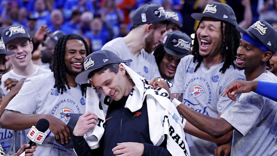 Thunder players celebrate with Mark Daigneault after advancing to the NBA Finals.