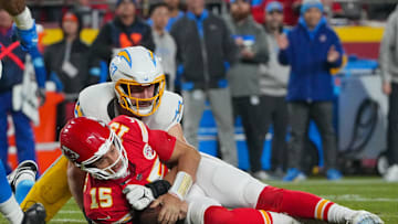 Dec 8, 2024; Kansas City, Missouri, USA; Kansas City Chiefs quarterback Patrick Mahomes (15) is sacked by Los Angeles Chargers linebacker Joey Bosa (97) during the first half at GEHA Field at Arrowhead Stadium. Mandatory Credit: Denny Medley-Imagn Images