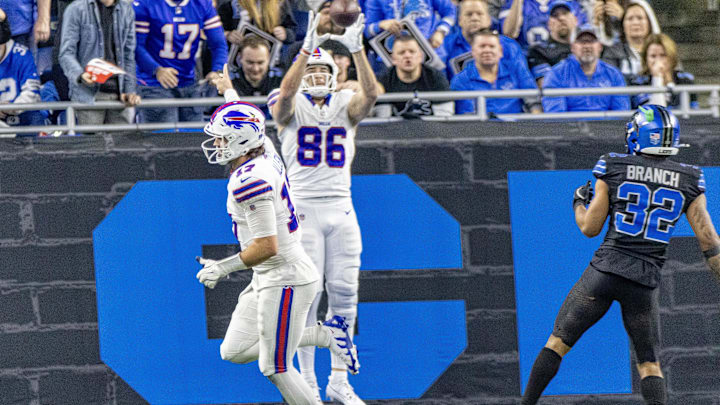 Dec 15, 2024; Detroit, Michigan, USA; Buffalo Bills quarterback Josh Allen (17) side arm tosses the ball to end Dalton Kincaid (86) for a touchdown