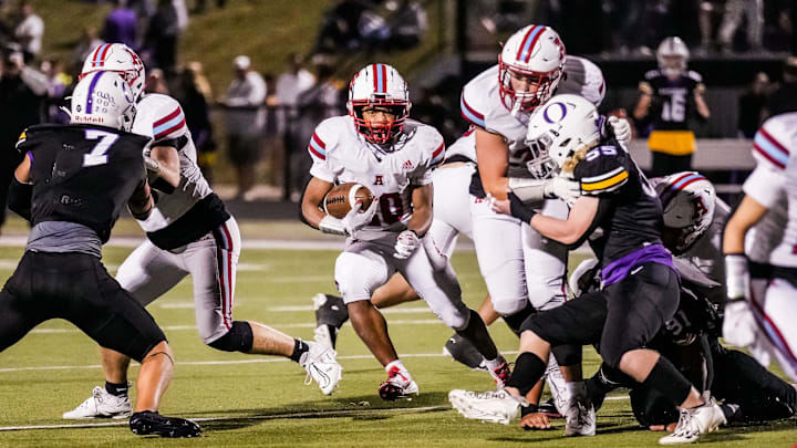 Arrowhead running back Jacob Siner (20) cuts through a gap during the game at Oconomowoc on Friday, Sept. 27, 2024. Arrowhead running back Jacob Siner (20) cuts through a gap during the game at Oconomowoc on Friday, Sept. 27, 2024.