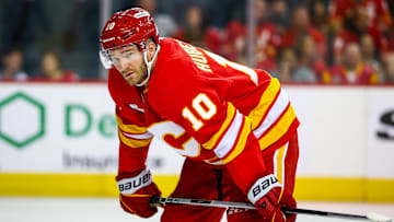 Oct 1, 2025; Calgary, Alberta, CAN; Calgary Flames left wing Jonathan Huberdeau (10) against the Vancouver Canucks during the second period at Scotiabank Saddledome. Mandatory Credit: Sergei Belski-Imagn Images