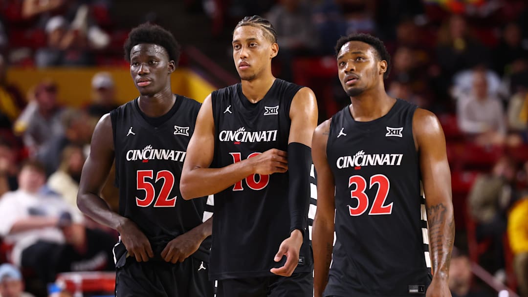 Jan 24, 2026; Tempe, Arizona, USA; Cincinnati Bearcats center Moustapha Thiam (52), forward Baba Miller (18) and guard Jalen Celestine (32) against the Arizona State Sun Devils at Desert Financial Arena. Mandatory Credit: Mark J. Rebilas-Imagn Images Jan 24, 2026; Tempe, Arizona, USA; Cincinnati Bearcats center Moustapha Thiam (52), forward Baba Miller (18) and guard Jalen Celestine (32) against the Arizona State Sun Devils at Desert Financial Arena. Mandatory Credit: Mark J. Rebilas-Imagn Images