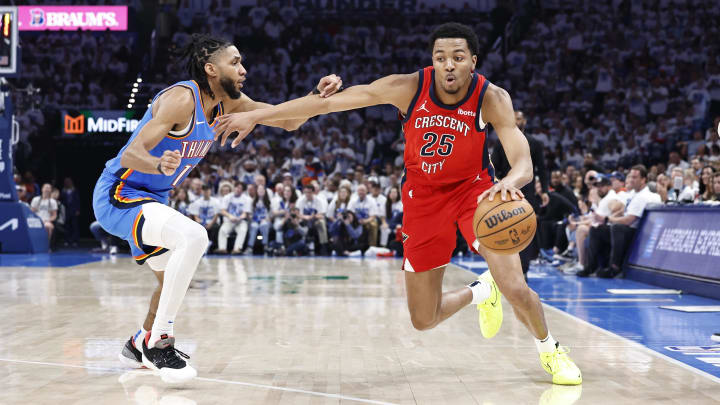 Apr 24, 2024; Oklahoma City, Oklahoma, USA; New Orleans Pelicans guard Trey Murphy III (25) drives around Oklahoma City Thunder guard Isaiah Joe (11) during the second quarter of game two of the first round for the 2024 NBA playoffs at Paycom Center.