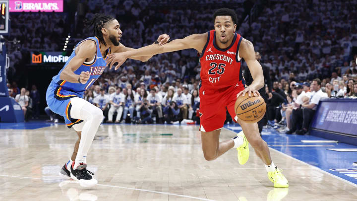 Apr 24, 2024; Oklahoma City, Oklahoma, USA; New Orleans Pelicans guard Trey Murphy III (25) drives around Oklahoma City Thunder guard Isaiah Joe (11) during the second quarter of game two of the first round for the 2024 NBA playoffs at Paycom Center.