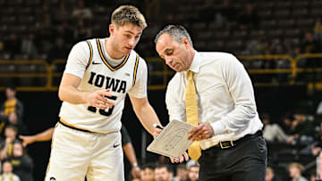 Nov 20, 2025; Iowa City, Iowa, USA; Iowa Hawkeyes head coach Ben McCollum reacts with guard Brendan Hausen (15) during the first half against the Chicago State Cougars at Carver-Hawkeye Arena. Mandatory Credit: Jeffrey Becker-Imagn Images