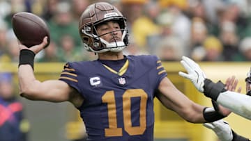 Green Bay Packers quarterback Jordan Love is pressed by Carolina Panthers linebacker Trevin Wallace (32) during the third quarter of their game Sunday, November 2, 2025 at Lambeau Field in Green Bay, Wisconsin.