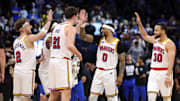 Feb 27, 2025; Orlando, Florida, USA; Golden State Warriors guard Stephen Curry (30) celebrates with guard Gary Payton II (0) center Quinten Post (21) after a play against the Orlando Magic in the fourth quarter at Kia Center. Mandatory Credit: Nathan Ray Seebeck-Imagn Images