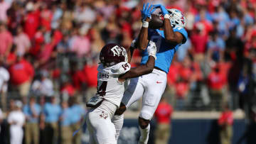 Nov 4, 2023; Oxford, Mississippi, USA; Mississippi Rebels wide receiver Tre Harris (9) catches the ball against Texas A&M Aggies defensive back Jayvon Thomas (14) during the first half at Vaught-Hemingway Stadium. Mandatory Credit: Petre Thomas-USA TODAY Sports