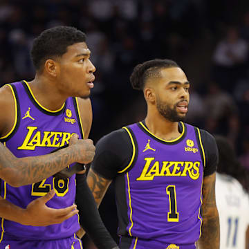 Dec 30, 2023; Minneapolis, Minnesota, USA; Los Angeles Lakers forward Rui Hachimura (28) reacts to his technical foul as he stands between forward Cam Reddish (5) and guard D'Angelo Russell (1) in the first quarter of the game with the Minnesota Timberwolves at Target Center. Mandatory Credit: Bruce Kluckhohn-Imagn Images