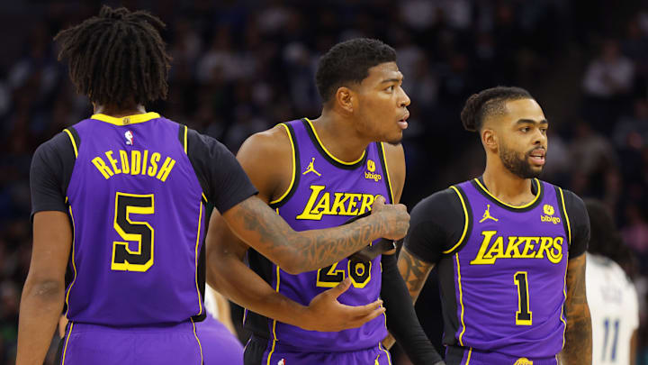 Dec 30, 2023; Minneapolis, Minnesota, USA; Los Angeles Lakers forward Rui Hachimura (28) reacts to his technical foul as he stands between forward Cam Reddish (5) and guard D'Angelo Russell (1) in the first quarter of the game with the Minnesota Timberwolves at Target Center. Mandatory Credit: Bruce Kluckhohn-Imagn Images