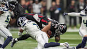 Dec 7, 2025; Atlanta, Georgia, USA; Seattle Seahawks safety Nick Emmanwori (3) upends Atlanta Falcons running back Tyler Allgeier (25) during the first half at Mercedes-Benz Stadium.