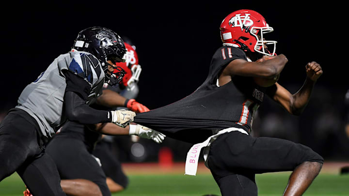 Vero Beach's Efrem White (11) runs during a playoff game against Lake Nona on Nov. 21, 2025.  The senior completed 13 of 19 passes for 159 yards and one touchdown and rushed 10 times for 74 yards and four scores to lead the Indians to a 49-23 victory against Dr. Phillips in the Class 7A, Region 3 final on Friday, Nov. 28, 2025.