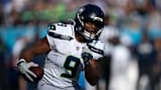 Seattle running back Kenneth Walker III (9) runs against Tennessee during their game at Nissan Stadium Sunday, Nov. 23, 2025.