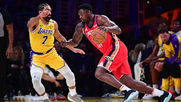 Mar 4, 2025; Los Angeles, California, USA; New Orleans Pelicans forward Zion Williamson (1) moves the ball against Los Angeles Lakers guard Gabe Vincent (7) during the first half at Crypto.com Arena. Mandatory Credit: Gary A. Vasquez-Imagn Images
