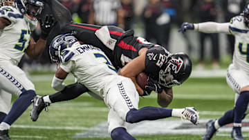 Dec 7, 2025; Atlanta, Georgia, USA; Seattle Seahawks safety Nick Emmanwori (3) upends Atlanta Falcons running back Tyler Allgeier (25) during the first half at Mercedes-Benz Stadium. Mandatory Credit: Dale Zanine-Imagn Images