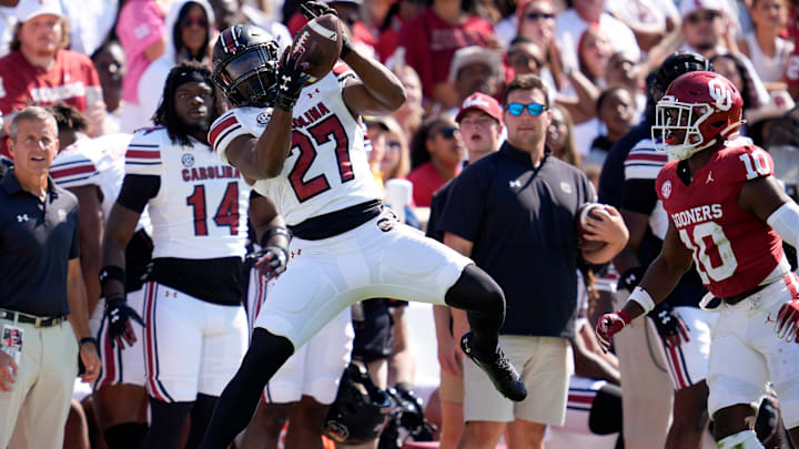 South Carolina Gamecocks running back Oscar Adaway III (27) catches a pass beside Oklahoma Sooners linebacker Kip Lewis (10) during a college football game between the University of Oklahoma Sooners (OU) and the South Carolina Gamecocks at Gaylord Family - Oklahoma Memorial Stadium in Norman, Okla., Saturday, Oct. 19, 2024.