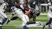 Dec 7, 2025; Atlanta, Georgia, USA; Seattle Seahawks safety Nick Emmanwori (3) upends Atlanta Falcons running back Tyler Allgeier (25) during the first half at Mercedes-Benz Stadium. Mandatory Credit: Dale Zanine-Imagn Images