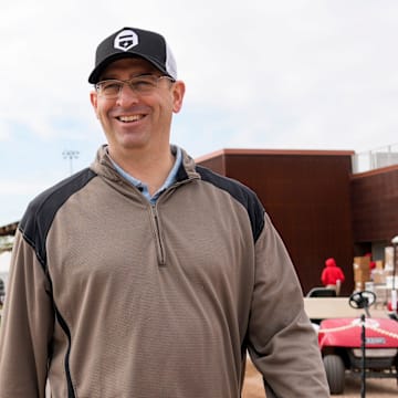 Reds president of baseball operations Nick Krall walks between fields at the Cincinnati Reds Player Development Complex in Goodyear, Ariz., on Wednesday, Feb. 12, 2025.