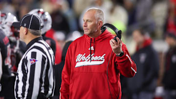 Nov 21, 2024; Atlanta, Georgia, USA; North Carolina State Wolfpack head coach Dave Doeren talks to a referee against the Georgia Tech Yellow Jackets in the fourth quarter at Bobby Dodd Stadium at Hyundai Field. 