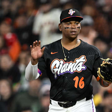 San Francisco Giants first baseman Rafael Devers (16) reacts against the Pittsburgh Pirates during the eighth inning at Oracle Park. 