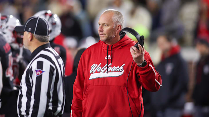 Nov 21, 2024; Atlanta, Georgia, USA; North Carolina State Wolfpack head coach Dave Doeren talks to a referee against the Georgia Tech Yellow Jackets in the fourth quarter at Bobby Dodd Stadium at Hyundai Field. Nov 21, 2024; Atlanta, Georgia, USA; North Carolina State Wolfpack head coach Dave Doeren talks to a referee against the Georgia Tech Yellow Jackets in the fourth quarter at Bobby Dodd Stadium at Hyundai Field.