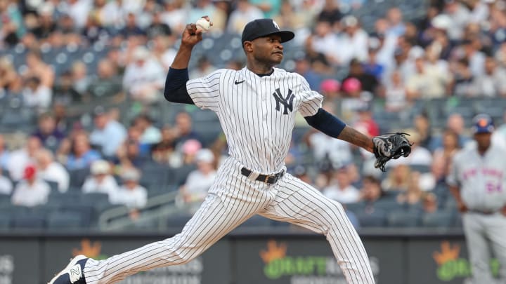 Jul 25, 2023; Bronx, New York, USA; New York Yankees starting pitcher Domingo German (0) delivers a pitch during the first inning against the New York Mets at Yankee Stadium. Mandatory Credit: Vincent Carchietta-USA TODAY Sports