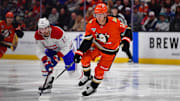 Feb 2, 2025; Anaheim, California, USA; Anaheim Ducks center Trevor Zegras (11) moves in for the puck against Montreal Canadiens right wing Josh Anderson (17) during the second period at Honda Center. Mandatory Credit: Gary A. Vasquez-Imagn Images