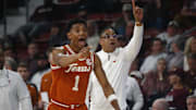 Mar 4, 2025; Starkville, Mississippi, USA; Texas Longhorns guard Julian Larry (1) and head coach Rodney Terry react during the first half against the Mississippi State Bulldogs at Humphrey Coliseum. Mandatory Credit: Petre Thomas-Imagn Images